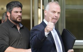 Michael McMahon gives photographers a thumbs up as he leaves Brooklyn Federal court, Wednesday, May 31, 2023, in New York.
