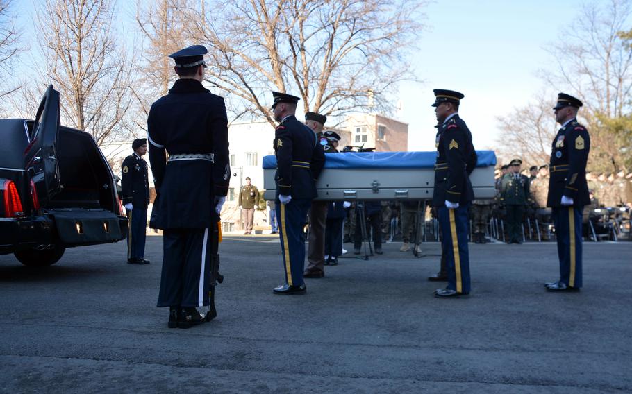Members of the United Nations Command honor guard carry the remains of a U.S. service member who died in the Korean War during a repatriation ceremony at Seoul National Cemetery, Wednesday, Feb. 22, 2023.