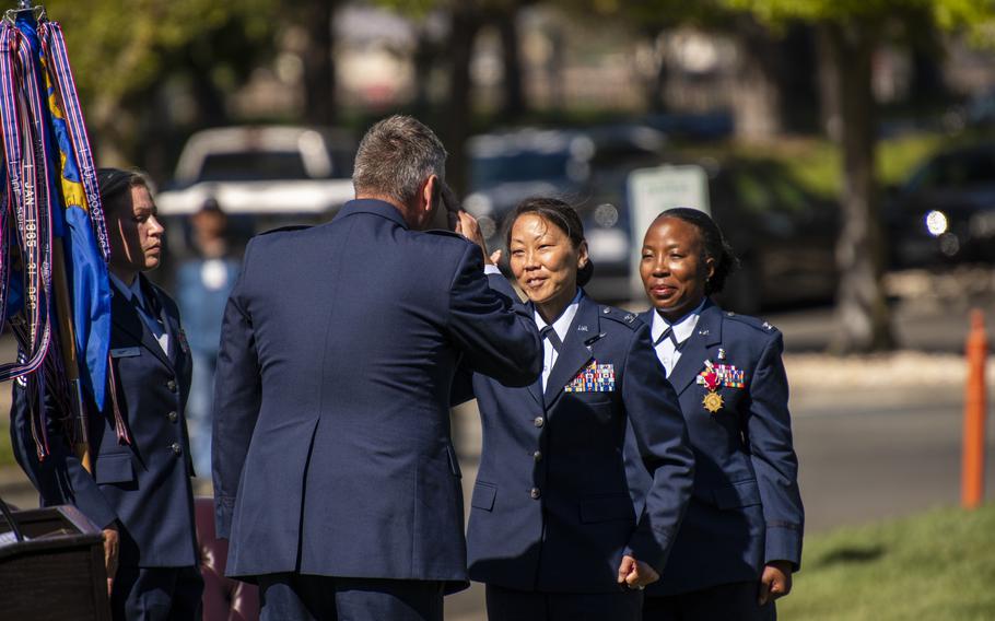 New David Grant Medical Center commander Col. Melissa Dooley accepts command of the Travis Air Force Base hospital, the Air Force’s largest, from 60th Air Mobility Wing commander Col. Corey A. Simmons as the outgoing hospital leader, Col. Gwendolyn Foster, looks on during a change-of command ceremony at the sprawling base south of Vacaville on July 12, 2022.