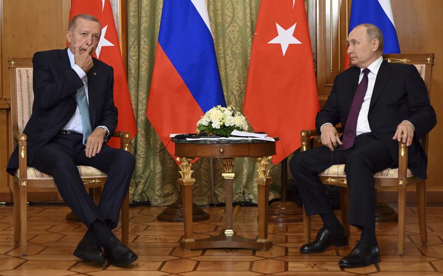 Russian President Vladimir Putin, right, speaks to Turkish President Recep Tayyip Erdogan during their meeting at Russia’s Black Sea resort of Sochi, Russia, Monday, Sept. 4, 2023. 