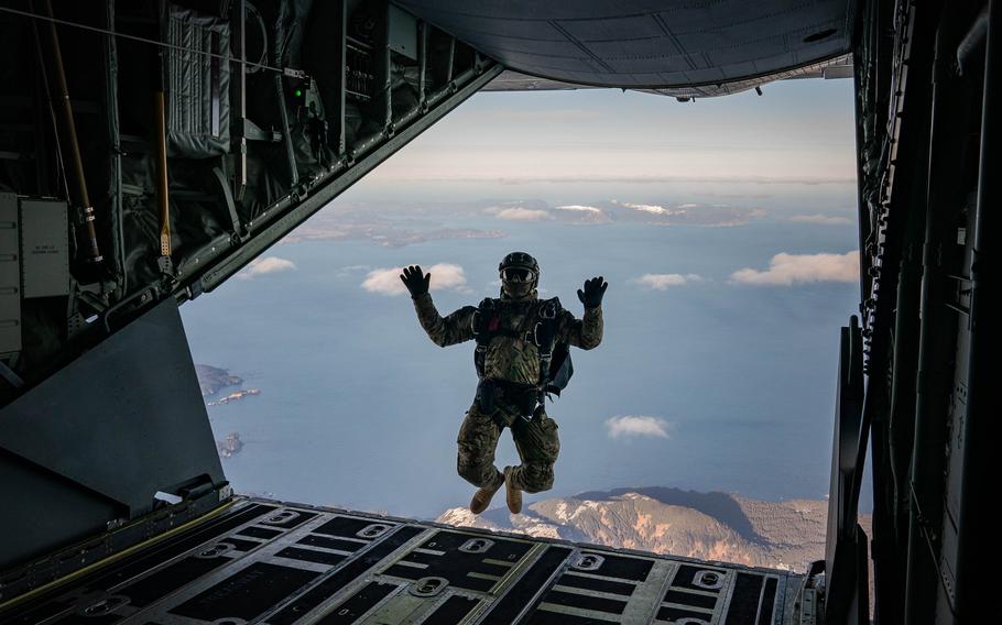 A Navy SEAL jumps from the transport plane. 