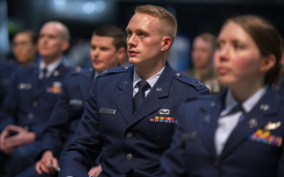 Capt. Charles Carr listens with his classmates as Air Force Secretary Frank Kendall speaks at the Air Force Institute of Technology graduation March 24, 2022, at Wright-Patterson Air Force Base in Ohio. In late December, Kendall announced that the service will once again consider advanced academic degrees when selecting officers for promotion to the ranks of major and lieutenant colonel.