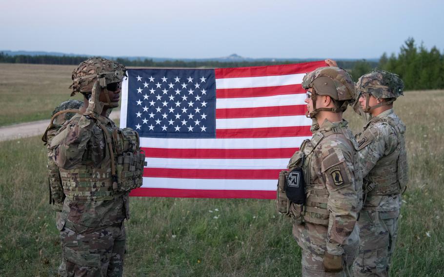 U.S. Army Spc. Dequan Simms is sworn in by 1st Lt. Randall Chergosky during his reenlistment ceremony at Grafenwoehr, Germany, Aug. 23, 2023. The Army temporarily ended its selective retention bonus program this week.