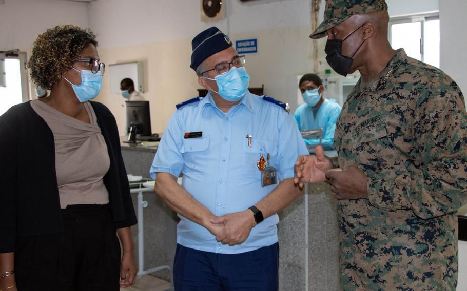 Gen. Michael Langley, commander of U.S. Africa Command, discusses military medicine with Angolan Brig. Gen. Armando Pinto and Francisca dos Reis, of the U.S. Embassy, during a visit to a hospital in Luanda, Angola, on Nov. 10, 2022. 