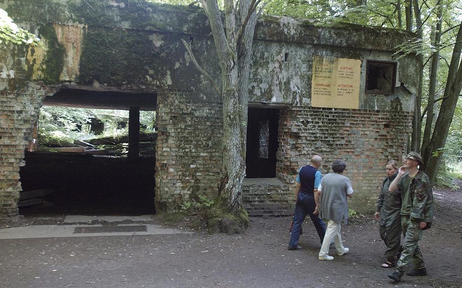 Tourists visit the ruins of Adolf Hitler’s headquarters the “Wolf’s Lair” in Gierloz, northeastern Poland, July 17, 2004, where his chief of staff members made an unsuccessful attempt at Hitler’s life on July 20, 1944. 