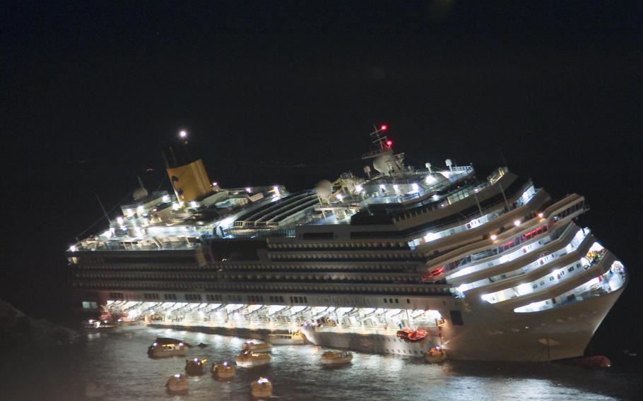 The luxury cruise ship Costa Concordia lays on its starboard side after it ran aground off the coast of the Isola del Giglio island, Italy on Jan. 13, 2012. 