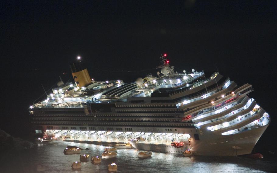 The luxury cruise ship Costa Concordia lays on its starboard side after it ran aground off the coast of the Isola del Giglio island, Italy on Jan. 13, 2012.