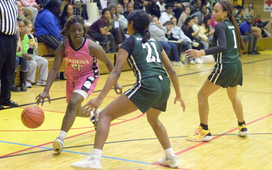 Kadena's Jayla Johnson gets bottled up by Kubasaki's Solares Solano and Nevaeh Gilbert during Friday's Okinawa girls basketball game. The Dragons won 28-24, giving them a 3-1 season-series edge over the Panthers, their first in 20 seasons.