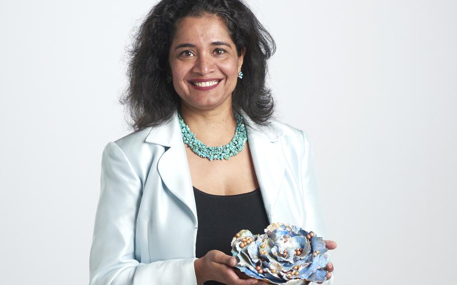Girija Kaimal holds a clay craft piece in this photo from 2018. Kaimal is president of the American Art Therapy Association, based in Alexandria, Va., and believes in the mental health benefits of getting creative.