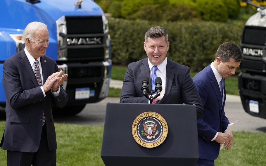 President Joe Biden applauds as former Rep. Patrick Murphy, chairman of the Veterans Trucking Task Force, speaks after Transportation Secretary Pete Buttigieg during an event about strengthening the supply chain with improvements in the trucking industry. The event took place on the South Lawn of the White House in Washington, on Monday, April 4, 2022.