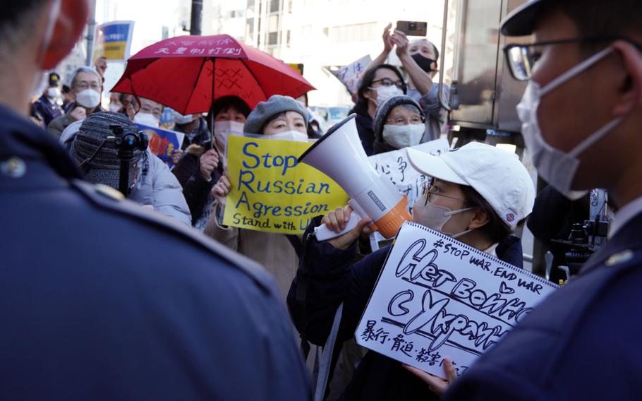 Japanese police block anti-war protesters from reaching the Russian embassy in Tokyo, Feb. 25, 2022.