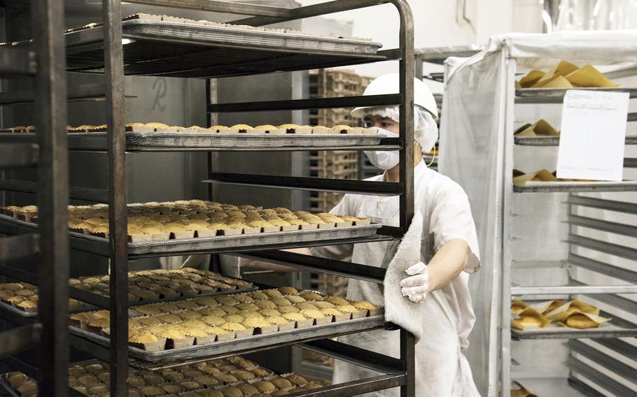 Shota Enomoto works inside the Yokota Bakery Plant on Yokota Air Base, Japan, Tuesday, April 19, 2022.