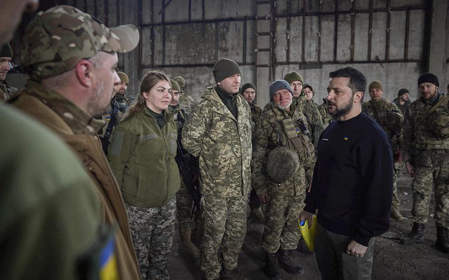Ukrainian president Volodymyr Zelenskyy talks to soldiers at a position near Bakhmut, Donetsk region, Ukraine, March 22, 2023.