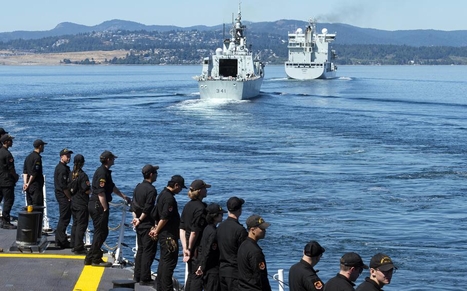 The Canadian supply ship MV Asterix and frigate HMCS Ottawa lead the way for HMCS Vancouver after departing for the Indo-Pacific on Aug. 14, 2023. 