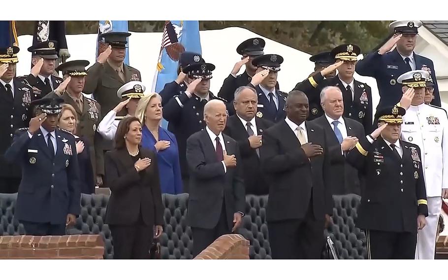A video screen grab shows the change of command ceremony for retiring Army Gen. Mark Milley, chairman of the Joint Chiefs of Staff, front right, and incoming chairman Air Force Gen. “CQ” Brown, front left. Between them are from left: Vice President Kamala Harris, President Joe Biden and Defense Secretary Lloyd Austin. The ceremony took place at Joint Base Myer-Henderson, Va., on Friday, Sept. 29, 2023.