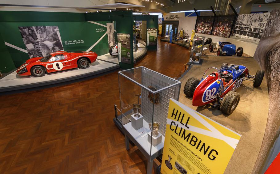 In this image provided by the The Henry Ford, various types of racing cars, including the 1967 Ford Mark IV Race Car, left, are on display as part of the Driven To Win exhibit at the The Henry Ford Museum in Dearborn, Mich.