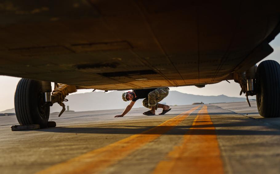 An airman checks for damage caused by gunfire from the Taliban on the UH-60, an aircraft lauded by crew for its speed and survivability. But with the U.S. pulling out of Afghanistan, maintaining the aircraft is becoming more difficult. 