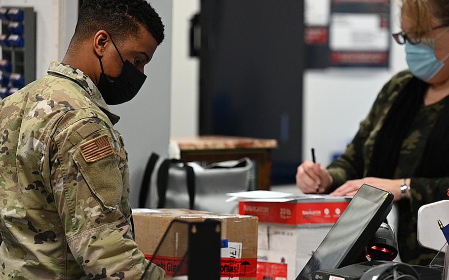  Airman 1st Class Michael Troutman, 786th Force Support Squadron postal clerk, assists a customer at the Northside Post Office on Ramstein Air Base, Germany, in October 2021. A military post office is warning patrons that packages they send to family members won’t be delivered if the U.S. customs form doesn’t bear the recipient’s first and last names.