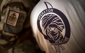 French Barkhane force soldiers who wrapped up a four-month tour of duty in the Sahel leave their base in Gao, Mali, June 9, 2021. French officials announced Monday Aug. 15, 2022, that the last soldier from the operation has now left Mali.