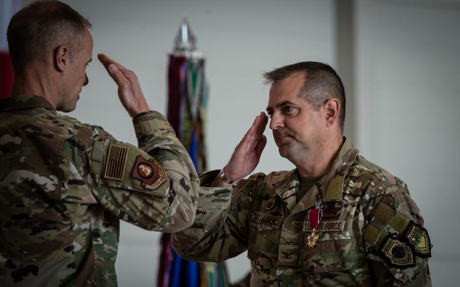 Col. Bryan Callahan salutes Maj. Gen. Derek France, the commander of 3rd Air Force, upon receiving the Legion of Merit award June 9, 2023, at Ramstein Air Base, Germany. Callahan was the commander of the 435th Air Expeditionary Wing and the 435th Air Ground Operations Wing.