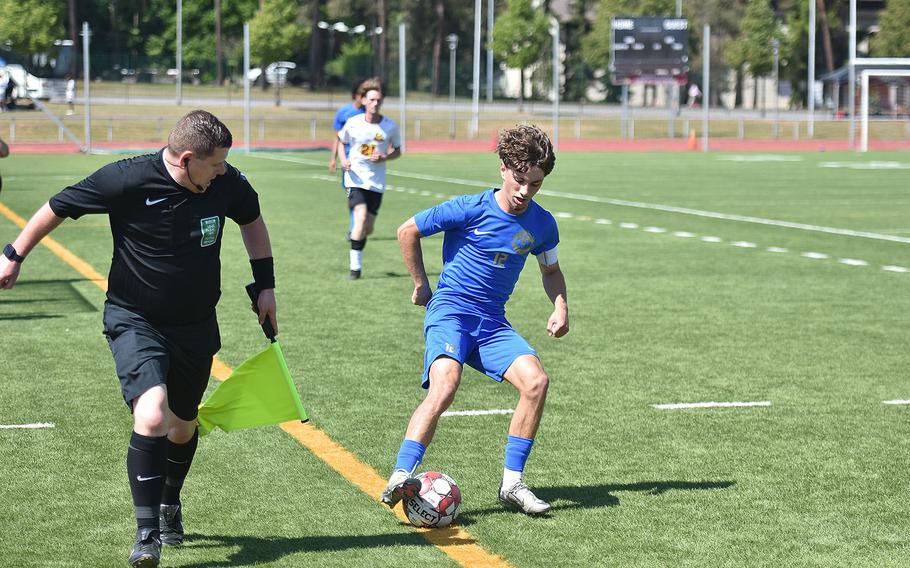 Sideline judge Paul Gregory watches Ramstein's Kai Woodstock keep the ball in play Monday, May 19, 2025, at the DODEA-Europe Division I boys soccer championships at Kaiserslautern, Germany.