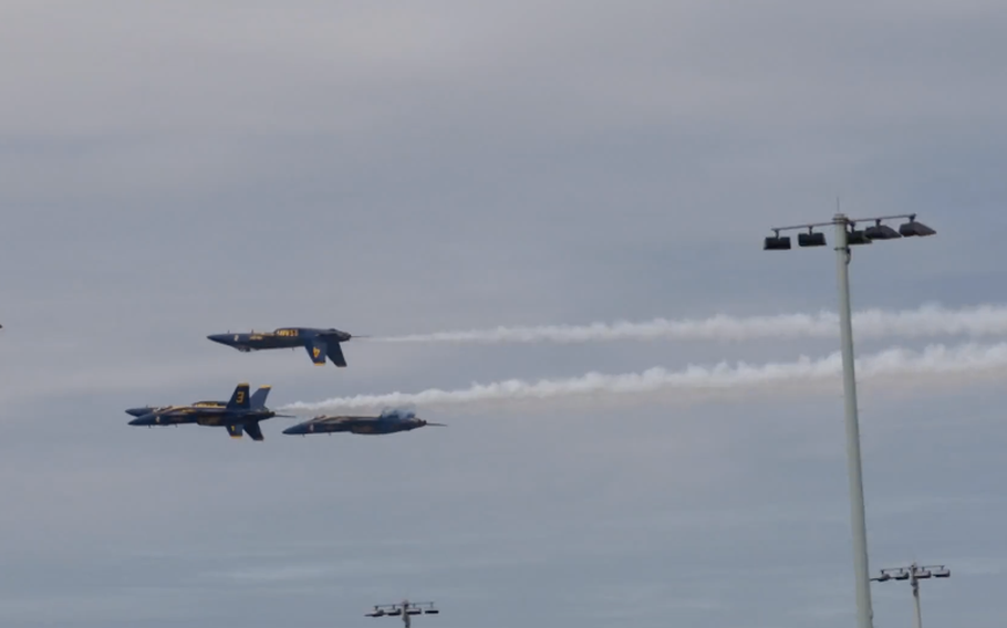 The United States Navy Blue Angels perform in their F-18 Super Hornets at a showcase at the U.S. Naval Academy.