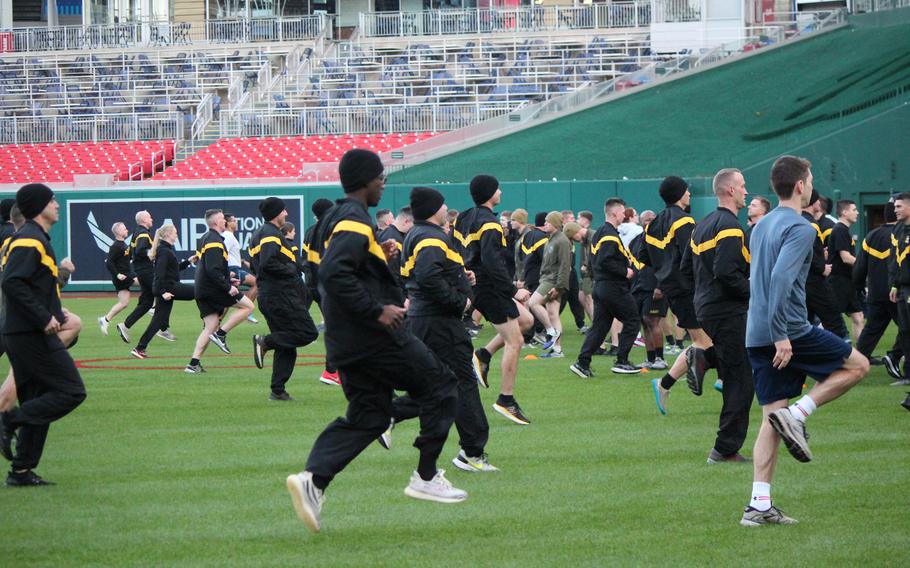 Participants in the final Base HIIT session of the season begin their warmups on the field Oct. 24, 2023, at Nationals Park in Washington, D.C.