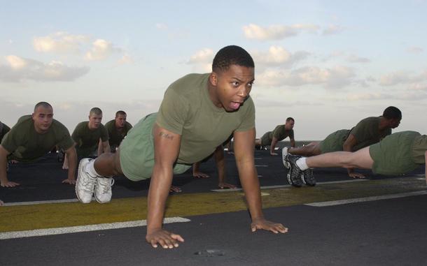 USS Bataan, Somewhere in the Arabian Sea, November 30, 2001: Lance Cpl. Travis McKenzie, 19, of Quitman, Miss., does a pushup during early morning exercise aboard the USS Bataan, somewhere in the Arabian Sea. McKenzie, and the rest of the 3rd Battalion, 6th Marines, are staying busy preparing themselves for a possible deployment to Aghanistan.Visit the Stars and Stripes store to order a copy of Stars and Stripes' photo book "15 years in Afghanistan," covering the years 2001 - 2016 https://www.stripesstore.com/15yearsinafghanistan-starsandstripesphotobook.aspx META TAGS: Operation Enduring Freedom, War on Terror, Afghanistan, USMC, U.S. Marines, U.S. Navy, amphibious assault ship, Wasp-class, aircraft carrier, USS Bataan Amphibious Ready Group (ARG)