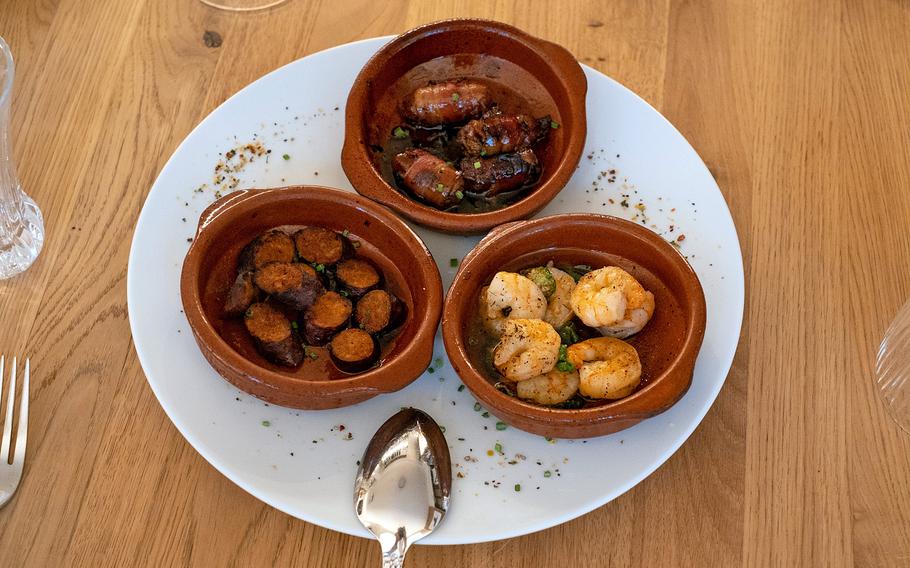 The tapas platter is a featured appetizer, with chorizo, bacon-wrapped dates and shrimp at Steaklounge in Weiden, Germany, Aug. 16, 2022.