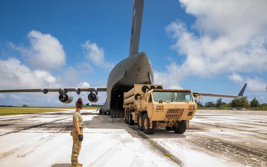 A launcher for a Terminal High Altitude Area Defense, or THAAD, missile defense system is unloaded from an Air Force C-17 at Rota International Airport, March 4, 2022.
