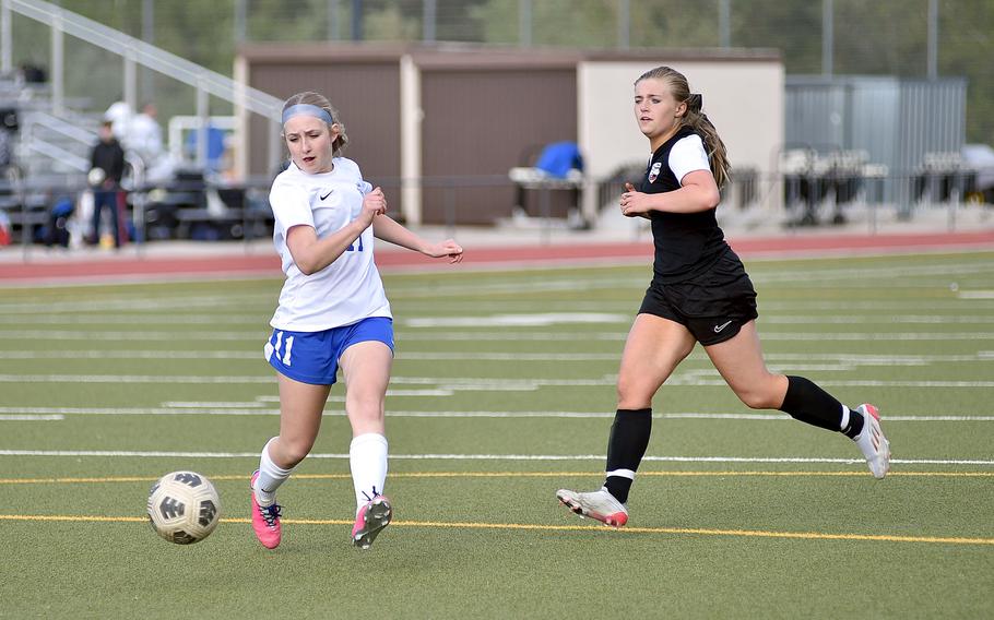 Ramstein midfielder Audrey Singer shoots as Stuttgart midfielder Eva Eaton trails the play during a match April 27, 2024, at Stuttgart High School in Böblingen, Gemany.