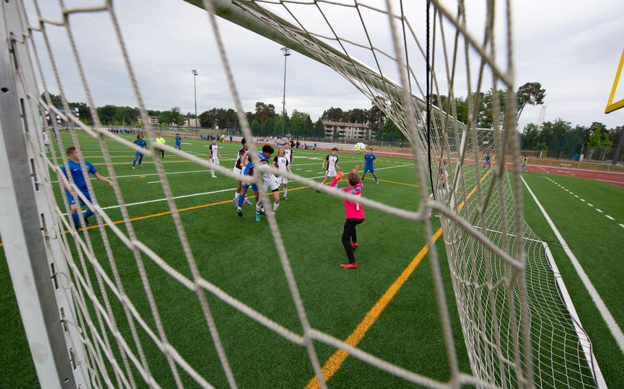 River Rocha of the Ramstein Royals sinks a header ball past Vilsecks goalie Lukas Ahrend, who could not react in time during the close play in the penalty box during the DODEA-Europe Soccer Championships at Ramstein Air Base, Germany, May 16, 2022. While, Ahrend and his teammates cut down a lot of opportunities for Team Ramstein, the Royals continued pressure throughout the game and defeated Vilseck 2-0. 