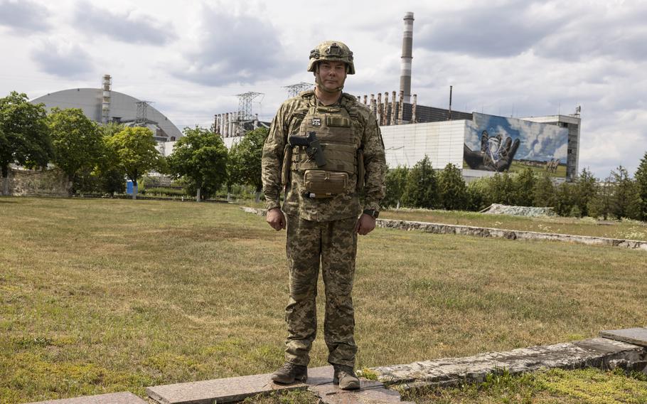 Lt. Gen. Serhiy Nayev, who commands Ukraine's northern forces, stands outside the premises of the Chernobyl nuclear power plant near the abandoned city of Pripyat in northern Ukraine. The Chernobyl facility is located 12 miles south of the border with Belarus. 