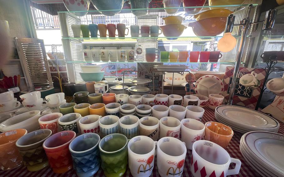 Fire King mugs and other vintage tableware at Big Mama on Base Side Street in Fussa, Japan.