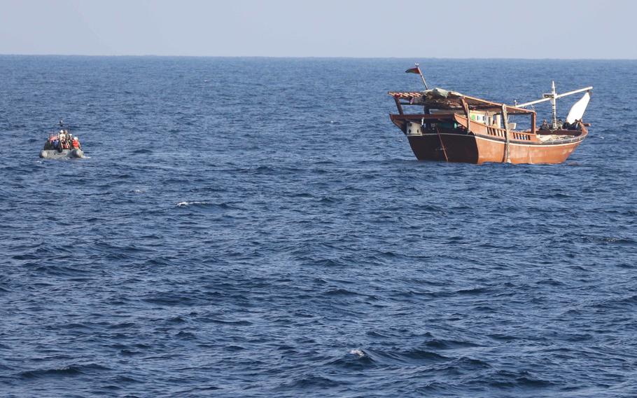 A boarding team from the patrol coastal ship USS Chinook approaches a fishing vessel in international waters of the Gulf of Oman, Jan. 6, 2023. U.S. naval forces seized 2,116 AK-47 assault rifles from a fishing vessel on a route from Iran to Yemen.