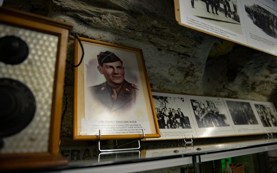 A photograph of U.S. Army Technician 5th Grade Robert Spaur is displayed at Le Militarial museum in Boissezon, France, May 27, 2022. Spaur parachuted into France’s Tarn region with Operational Group PAT of the Office of Strategic Services and was killed in action Aug. 12, 1944, during a firefight with German troops.