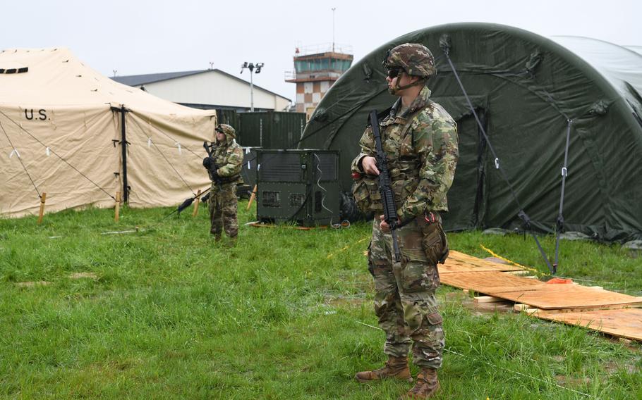 Soldiers secure the perimeter of a temporary field hospital at Baumholder Army Airfield, Germany, on May 17, 2024.