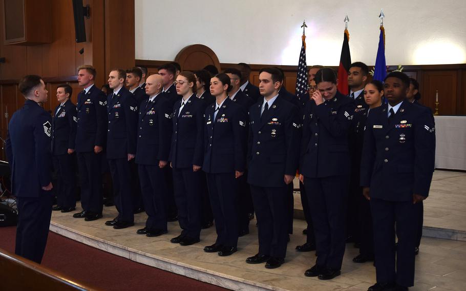 Airmen with the 569th U.S. Forces Police Squadron Delta Flight stand for a final guard mount during a memorial service for Senior Airman Christopher Rocha on Sept. 26, 2023. When Rocha’s name was called during the roll call, the airmen stood in silence. 