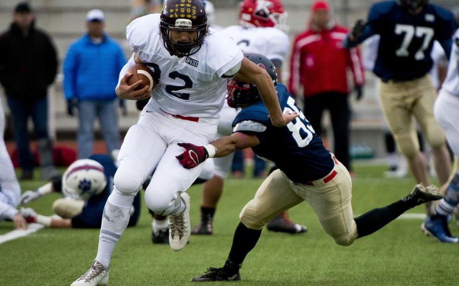 Vilseck’s Xavier Scott, left, break’s a tackle by Lakenheath’s Christopher Cruz at the DODEA-Europe all-star football game in Kaiserslautern, Germany, Nov. 12, 2016. Scott has signed an NFL contract with the Indianapolis Colts as an undrafted free agent.