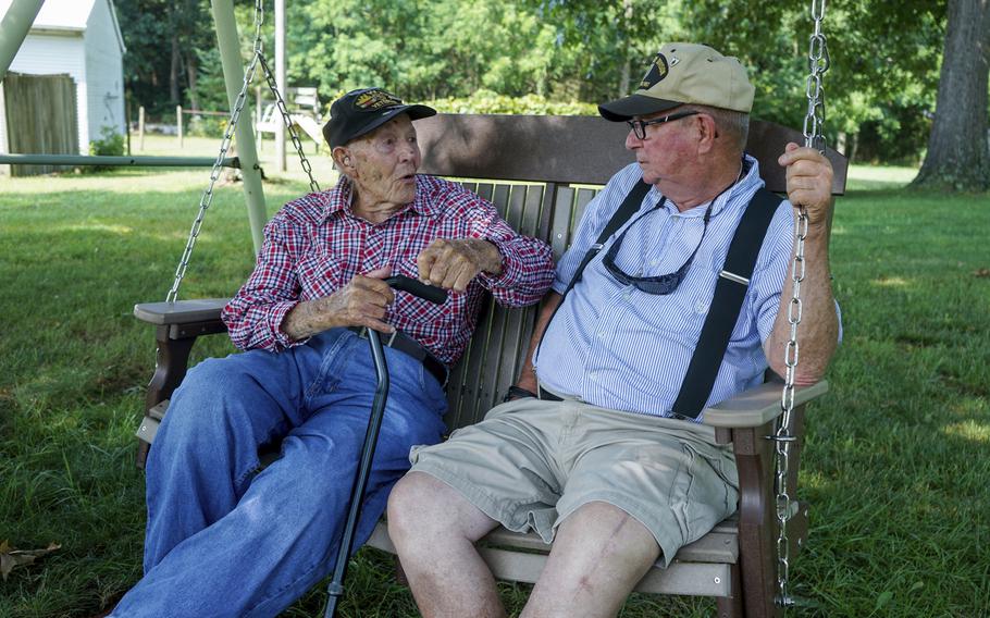 World War II veteran Beverly Salyards, left, sits with Vietnam veteran Larry Ritchie, right, at Ritchie's home in Rockingham County, Va. 