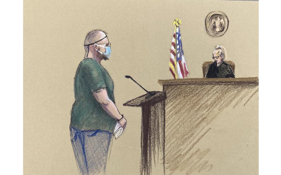 Oath Keepers founder Stewart Rhodes stands in front of Magistrate Judge Kimberly C. Priest Johnson in federal court in Plano, Texas, on Jan. 14. 