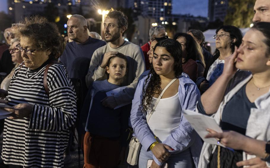 People gather in Tel Aviv on Nov. 25, 2023, as they wait for news of the release of a group of hostages.