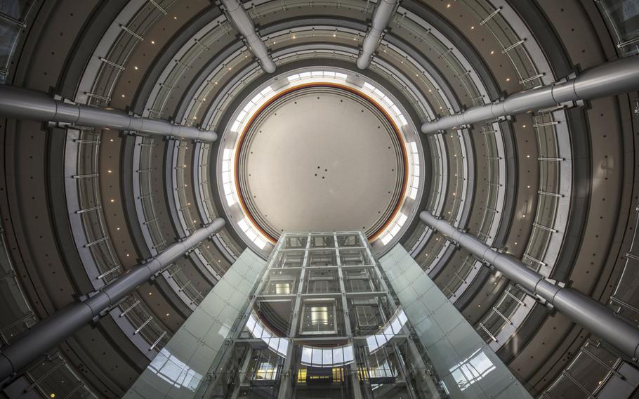 The colors of the German flag are displayed at the top of the atrium inside the German Center for Industry and Trade in Shanghai, China, on Thursday, Aug. 30, 2018. 