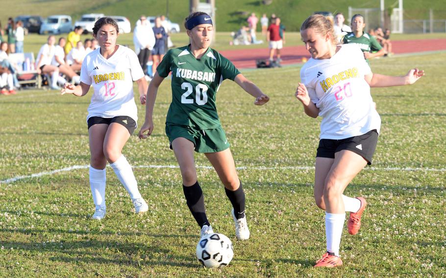Victoria Facchini and Whitney Cook battle for the ball.