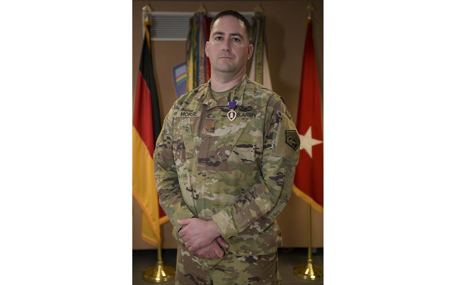 U.S. Army Maj. Robert Morse, chief of theater operations for Regional Cyber Center-Europe, U.S. Army Cyber Command, wears the Purple Heart award after being presented with it during a small ceremony at the Lt. Gen. Geoffrey Keyes Building on Clay Kaserne, on Dec. 17, in Wiesbaden, Germany. Morse was awarded the Purple Heart for a traumatic brain injury and other injuries he sustained during the Jan. 8, 2020, Iranian missile attack against al Asad Air Base in Iraq. 