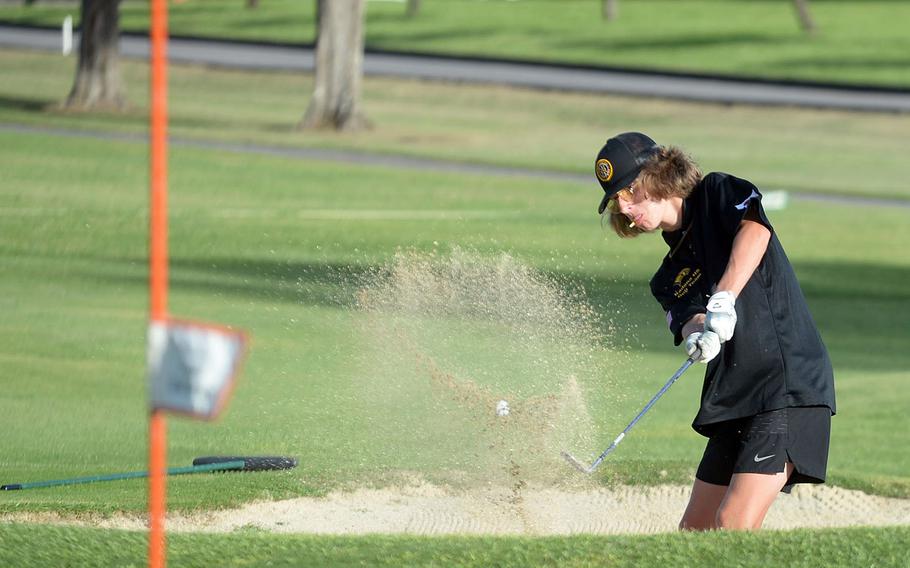 Kadena's Carter Johnson blasts out of the bunker on the 12th hole.