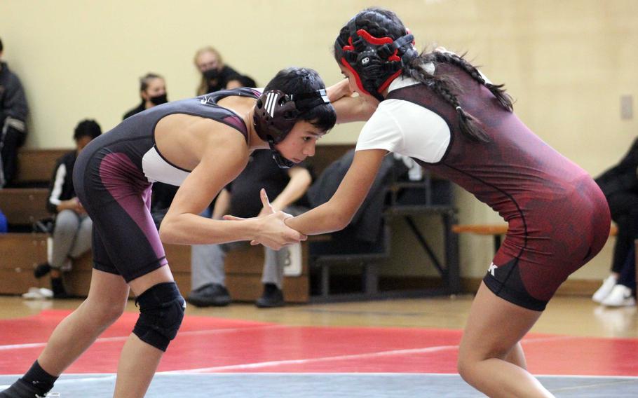 Matthew C. Perry's Greg Campbell and E.J. King's Abriell Shand-Pike battle for control at 108 pounds during Saturday's DODEA-Japan wrestling tri-meet. Campbell won by pin in 2 minutes, 20 seconds and the Samurai won the dual 44-21.
