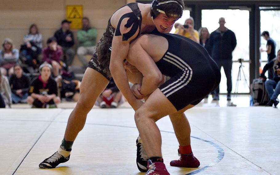 Stuttgart's Jack Gruver fights off an attack by Vilseck's Garrett Hyten in a 190-pound match at the DODEA sectional wrestling tournament on Feb. 3, 2024, at Stuttgart High School in Boeblingen, Germany.