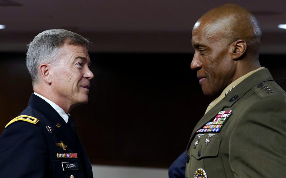 Marine Corps Lt. Gen. Michael Langley, right, and Army Lt. Gen. Bryan Fenton, left, talk July 21, 2022, after a Senate Armed Services Committee on Capitol Hill in Washington to examine their nominations to lead Africa Command and Special Operations Command respectively. The Senate unanimously voted for the promotions on Monday, Aug. 1, 2022.