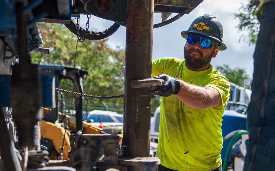 A Navy contractor works on a drill rig in Aiea, Hawaii, April 27, 2022. The rig was used to establish groundwater monitoring wells in connection with jet fuel contamination of the Navy’s water system for communities on and near Joint Base Pearl Harbor-Hickam.